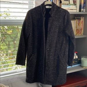 Black with gray threading collarless coat.